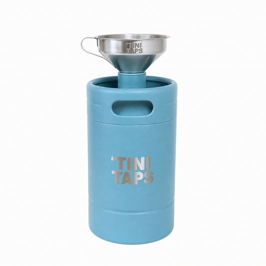 A light blue ‘Tini Tank with a stainless steel funnel inserted into the top, branded 'TINI TAPS' on a white background.