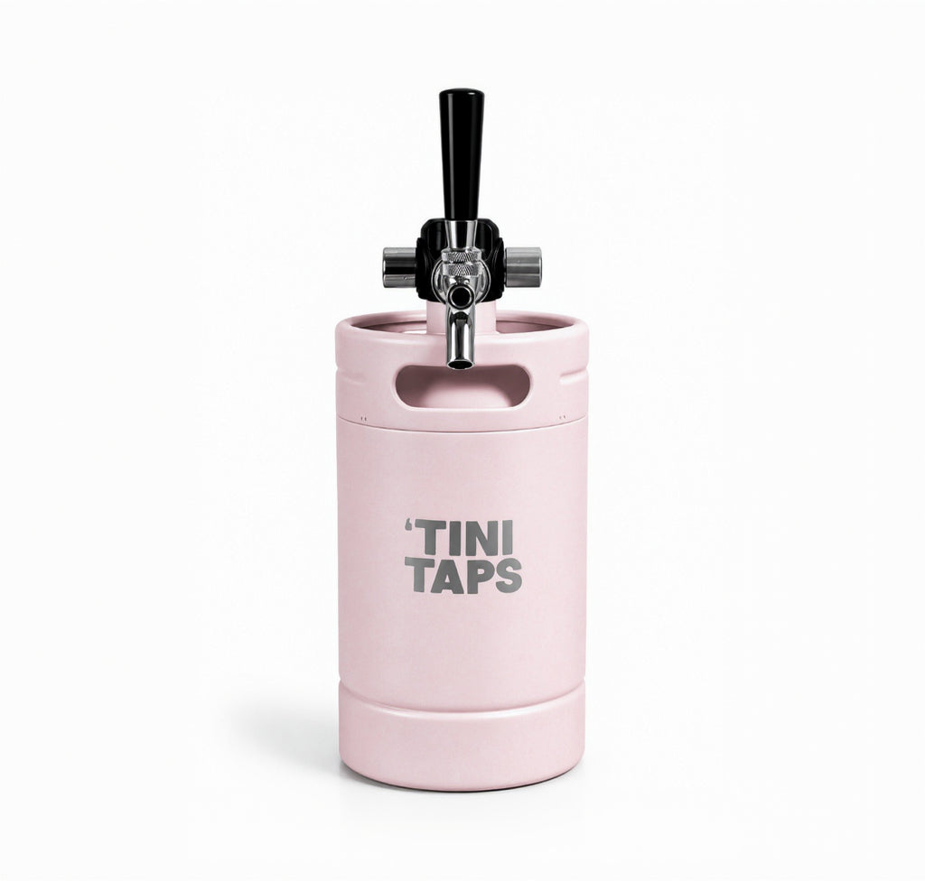 Pink mini keg with tap and 'Tini Taps logo on white background.