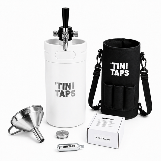 XL Tini Taps starter kit on a white background, including a white insulated mini keg with black tap handle, black carrying bag, stainless steep funnel, travel lid, CO2 cylinder, and product box.